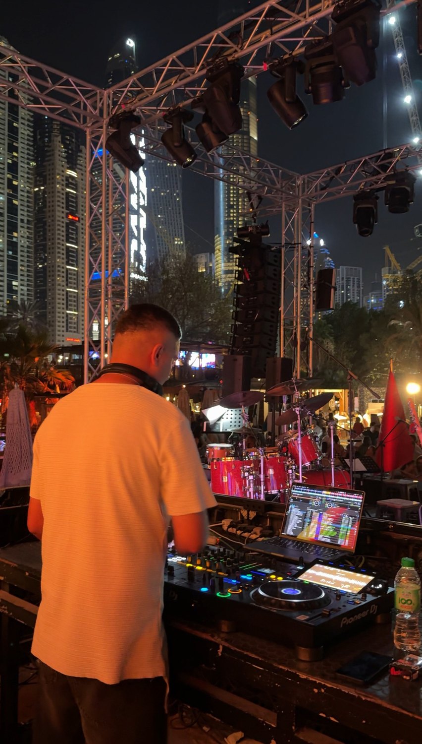DJ KAYA performing at an outdoor city stage